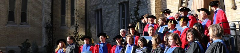 Image depicts students in the faculty of theology dressed in convocation regalia