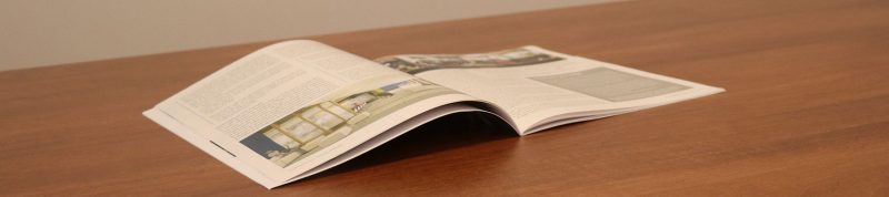 Image depicts a copy of the St.Mikes magazine sitting open on a table