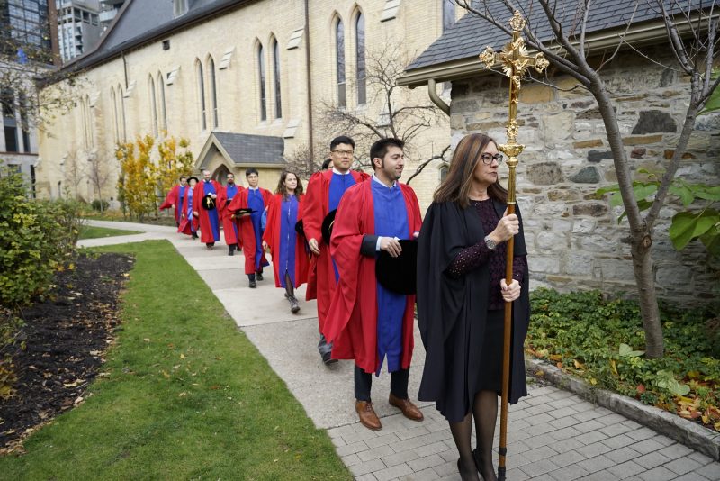 Theology grads waiting to process