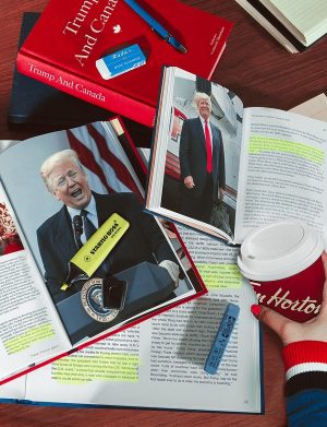 An illustration of open textbooks and a Tim Horton's coffee cup that accompanied an article in Vanity Fair on the "Trump and the Media" class.
