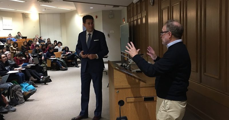 Image depicts Sam Tanehaus teaching a lecture about President Donald Trump