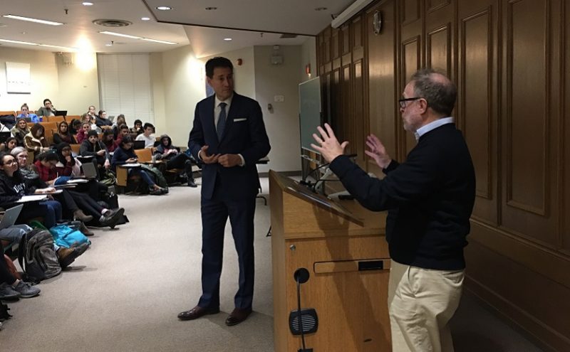 Image depicts Sam Tanehaus teaching a lecture about President Donald Trump