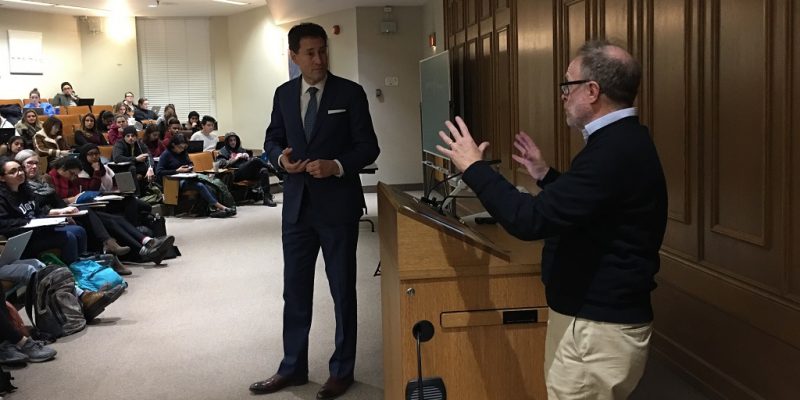 Image depicts Sam Tanehaus teaching a lecture about President Donald Trump