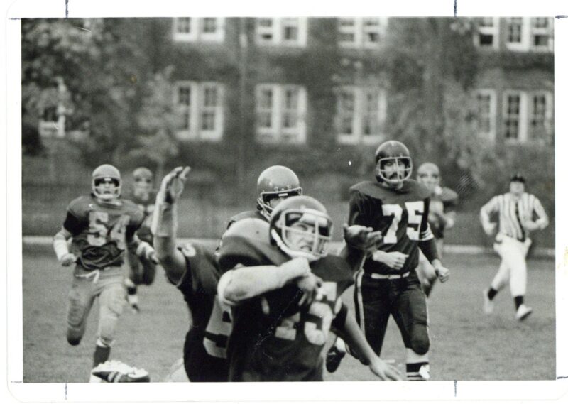 An archival image of a football game in progress at St. Michael's. 