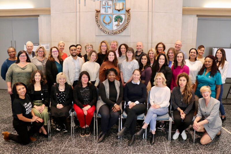 A cohort in the St. Michael's CSR program pose for a photograph in Charbonnel Lounge. 