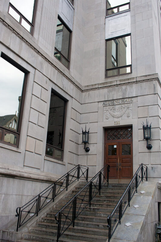 The front door and stairs on the exterior of Muzzo Alumni Hall on the St. Michael's campus 