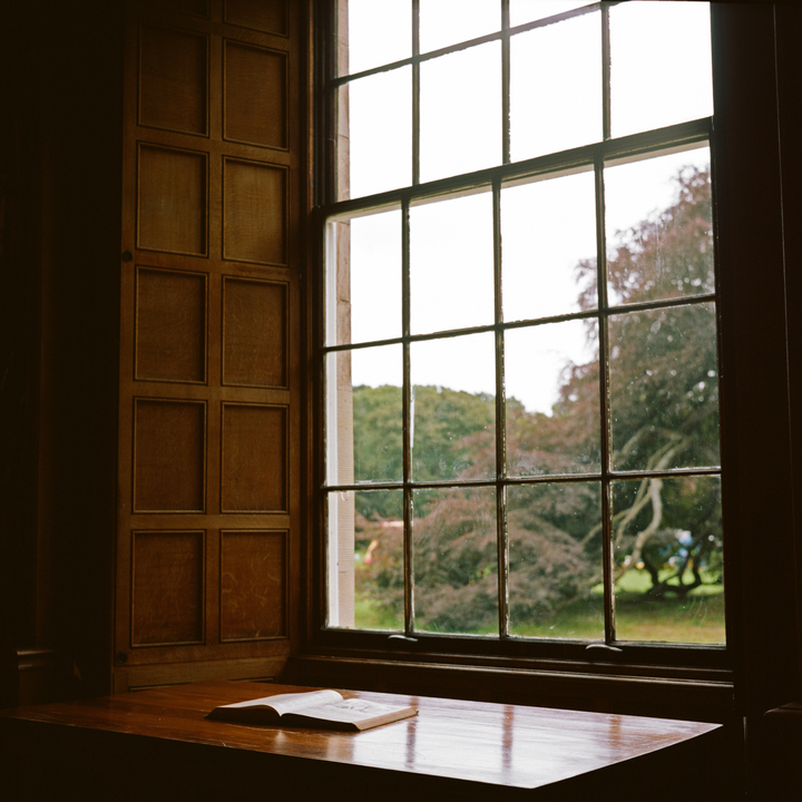 Image of an open window looking out onto an autumn landscape