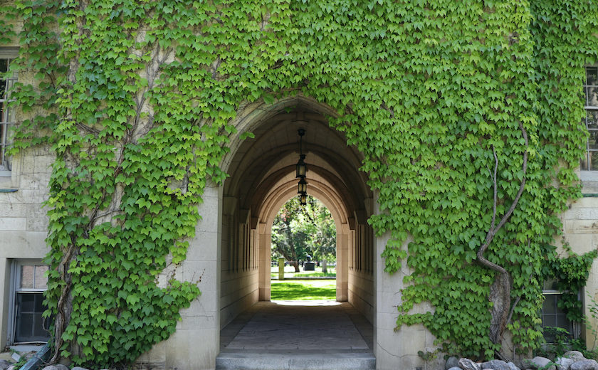 Image depicts the USMC arch in the Quad on a sunny spring day