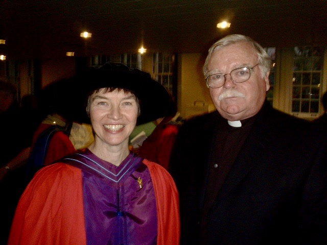 Photograph of Michael Fahey, S.J. standing next the late Dr. Margaret O’Gara in her academic robes.