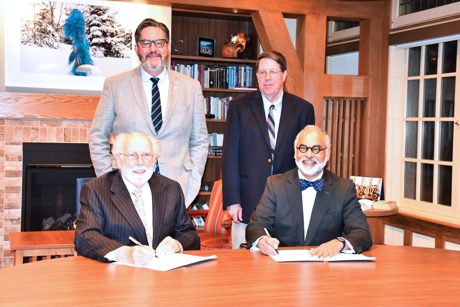 top row (L-R): David Sylvester, President, University of St. Michael’s College. // Thomas Worcester, President, Regis College  bottom row (L-R):  Peter Warrian, Chair, Regis College Governing Council  // Paul Harris, Chair, University of St. Michael’s College Collegium