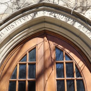 Image depicts the Latin over the door of PIMS