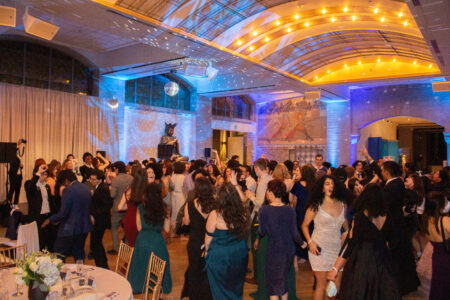 Group of students in formal dress a dance hall 