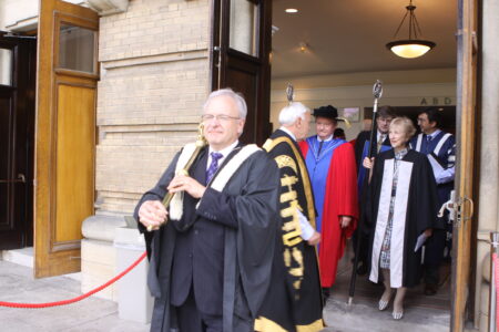 Andy Lubinski carries the Mace at Convocation.