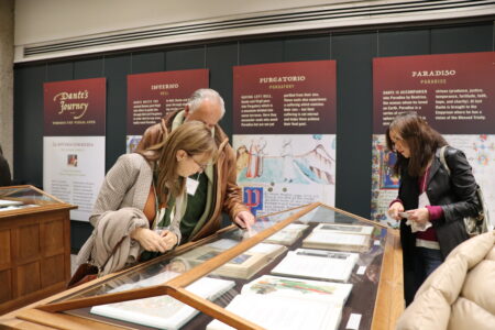 People look at the Dante exhibit in the Kelly Library.