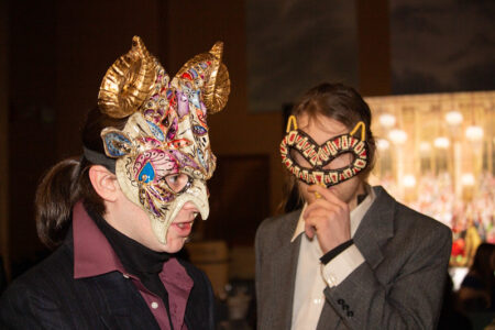 Students wearing masks at the masquerade ball