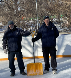Groundskeeper John Scarcelli and Senior Building Operator Mike Graham stand on the ice rink at the University of St. Michael's College