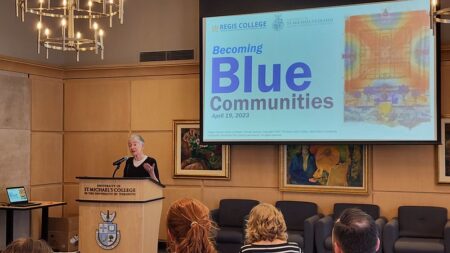 Maude Barlow congratulates the University of St. Michael's College on becoming a Blue Community.