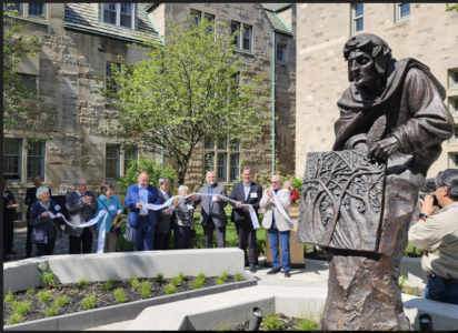 Guests cut a ribbon to formally open The Dante Garden at St. Mike's