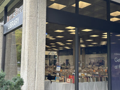 A glimpse of the book sale from outside Kelly Library