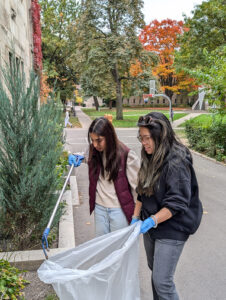 Staff and students help clean up the campus in preparation for winter