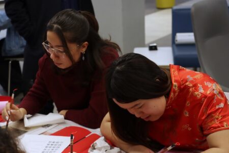 Students practice Chinese Mongolian Calligraphy