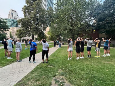 Run club members stretch before a run