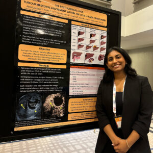 Anna Samuel with her conference presentation on the post-surgical liver.