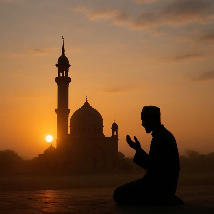 praying by a mosque in silhouette